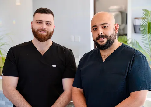 Dr. M. Bleibel and Dr. Malik Mahmood at Desoto Dentures and Implants